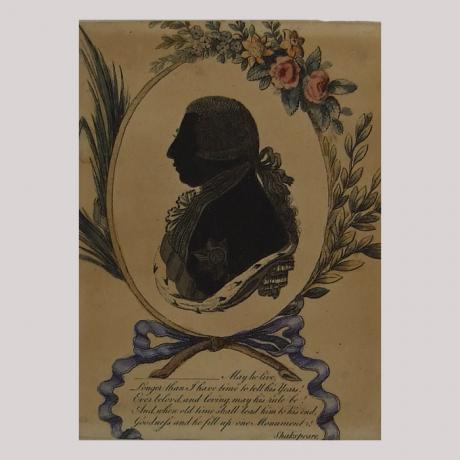 Silhouette of a man with nobel clothing facing left, framed by flowers and grinding