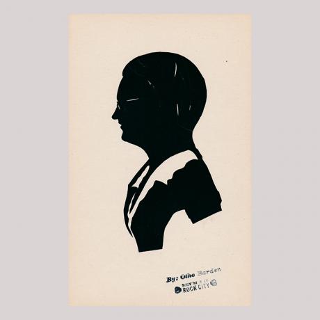 
        Front of silhouette, with man looking left, wearing glasses.