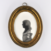 Front of silhouette, in frame, with young girl looking left.