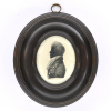 Front of silhouette, in frame, with man looking left, wearing a stock.