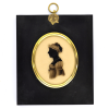 Front of Silhouette, in frame, with woman looking left and wearing a bonnet